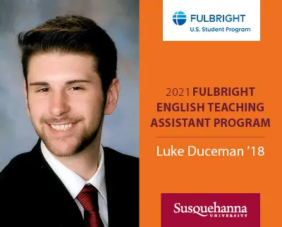 A person in a suit and tie smiles in a formal portrait next to a Fulbright U.S. Student Program logo. Text reads: "2021 Fulbright English Teaching Assistant Program. Luke Duceman '18." A Susquehanna University logo appears at the bottom.