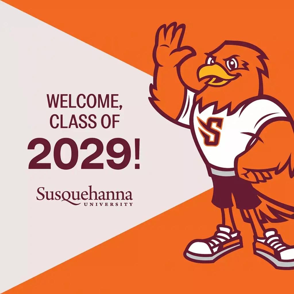 Illustrated mascot of a bird sporting sneakers and a Susquehanna University shirt, waving. Text reads "Welcome, Class of 2029!" against an orange and white background. Discover exclusive digital downloads to commemorate your arrival!.